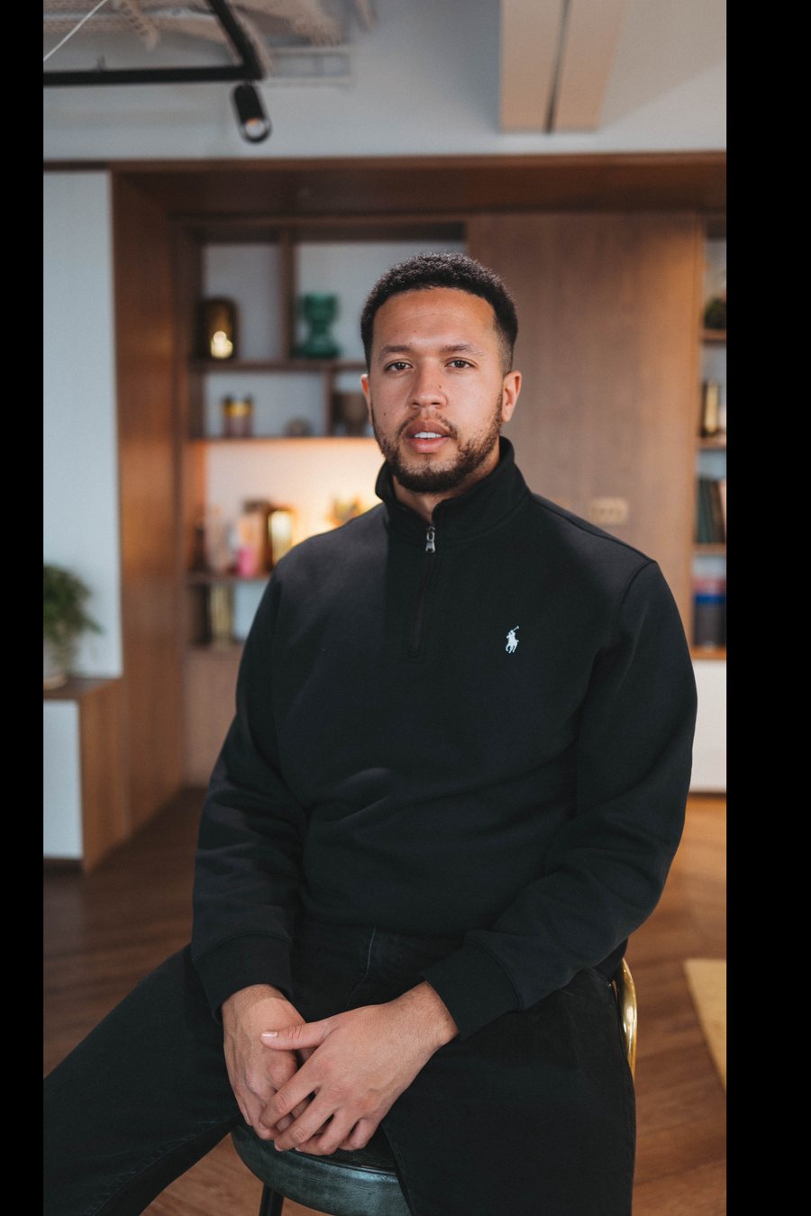 Joshua Hutchinson, founder of Flexi Media, seated in a studio